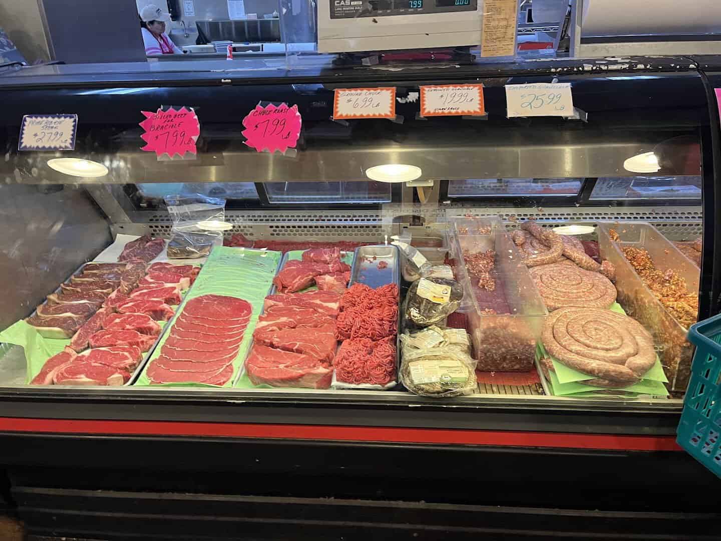 Deli case of Italian meats and sausages at Jimmy's Food Store in Dallas