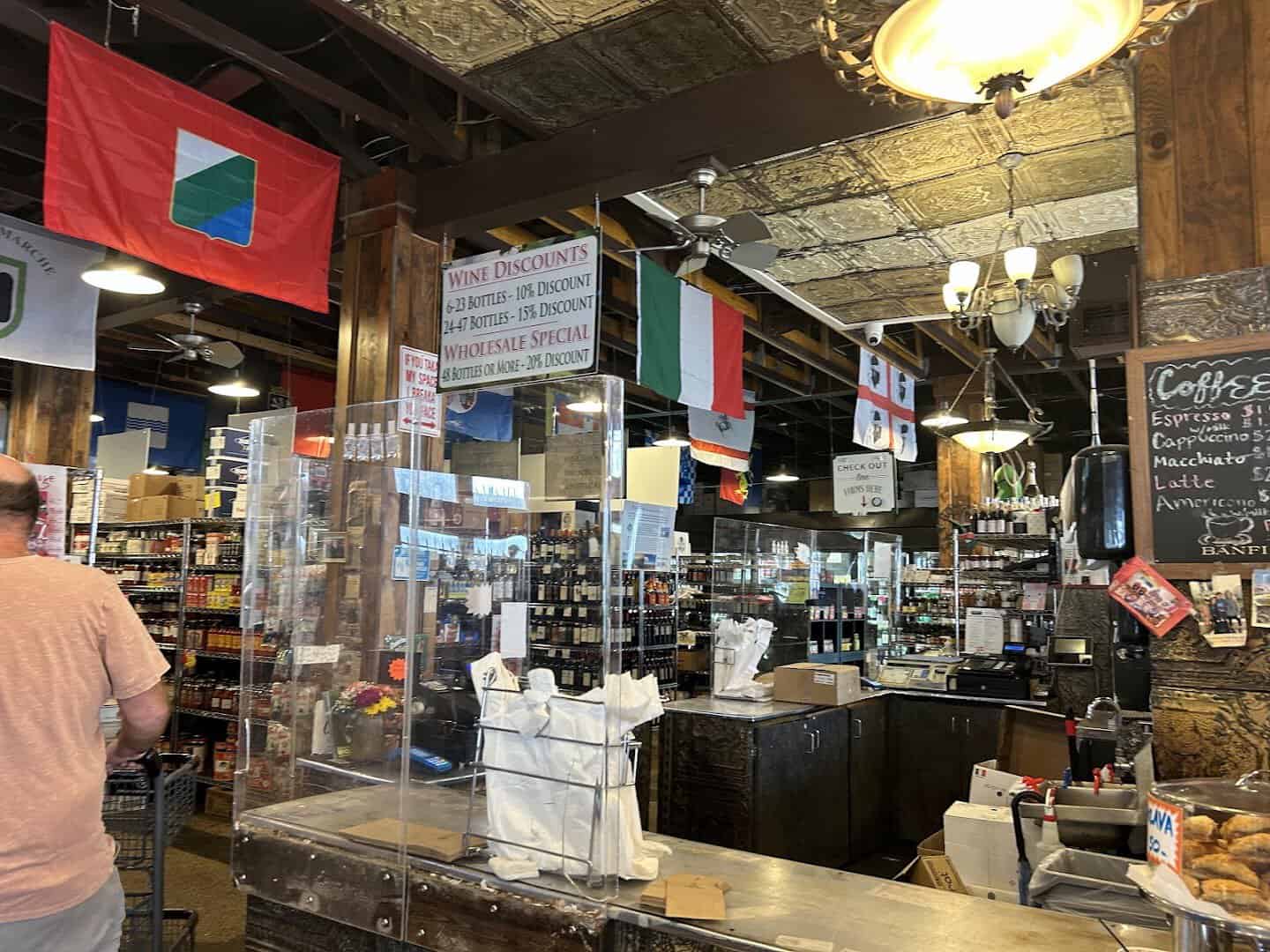 Interior counter and Italian flags inside Jimmy's Food Store in Dallas