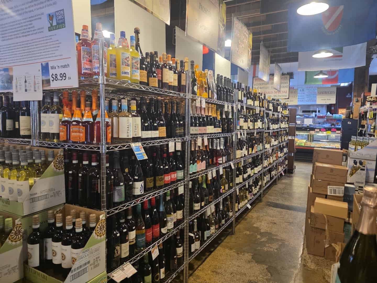 Aisle of Italian wine under regional flags at Jimmy's Food Store in Dallas