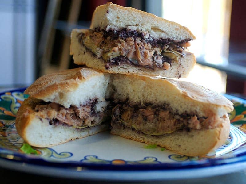 Stacked Italian sandwich with olive spread and artichoke at Jimmy's Food Store in Dallas