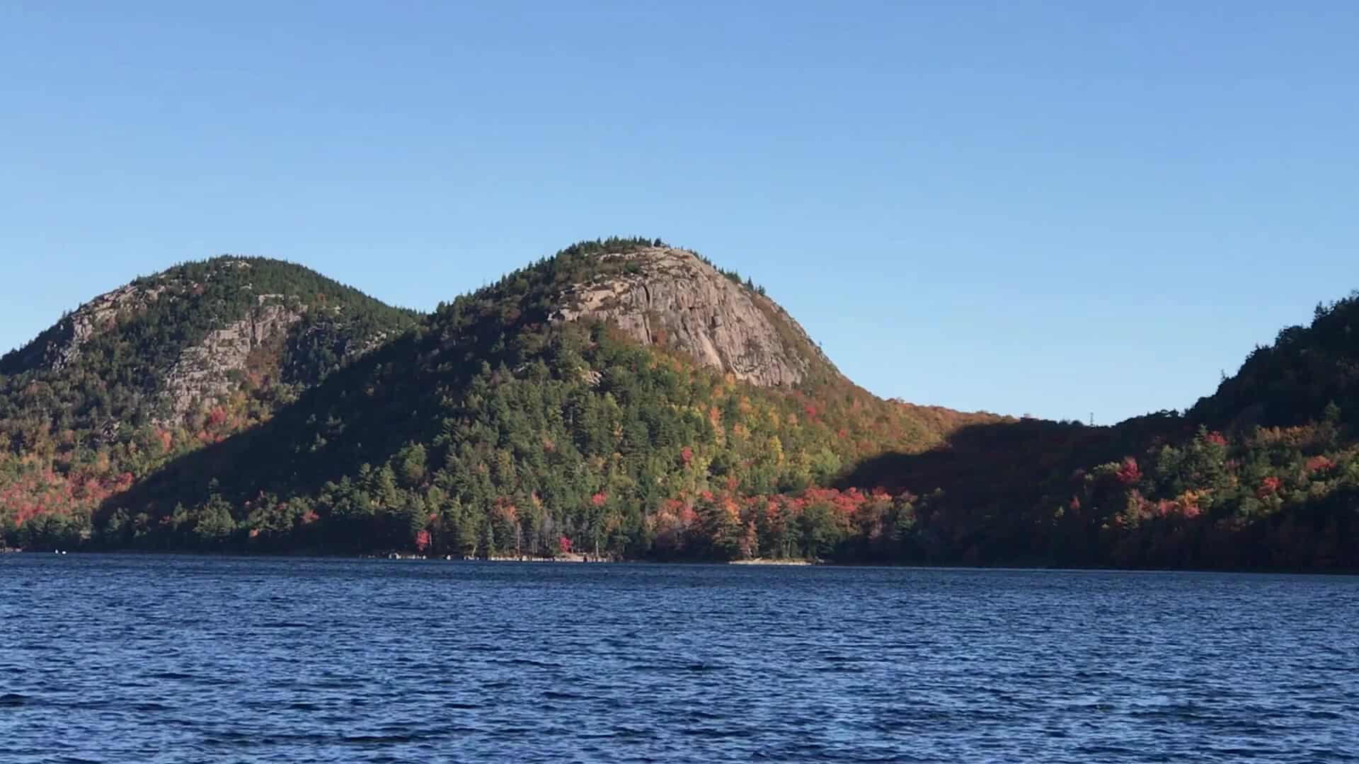 Fall color on the Bubbles mountains above Jordan Pond in Acadia National Park near Bar Harbor, Maine