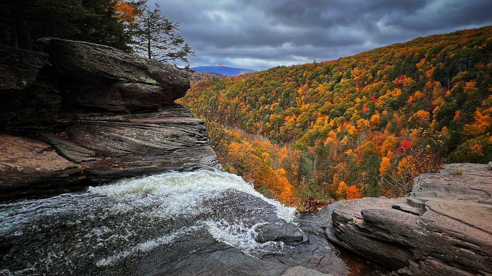 Kaaterskill Falls framed by autumn foliage in the Catskills, New York
