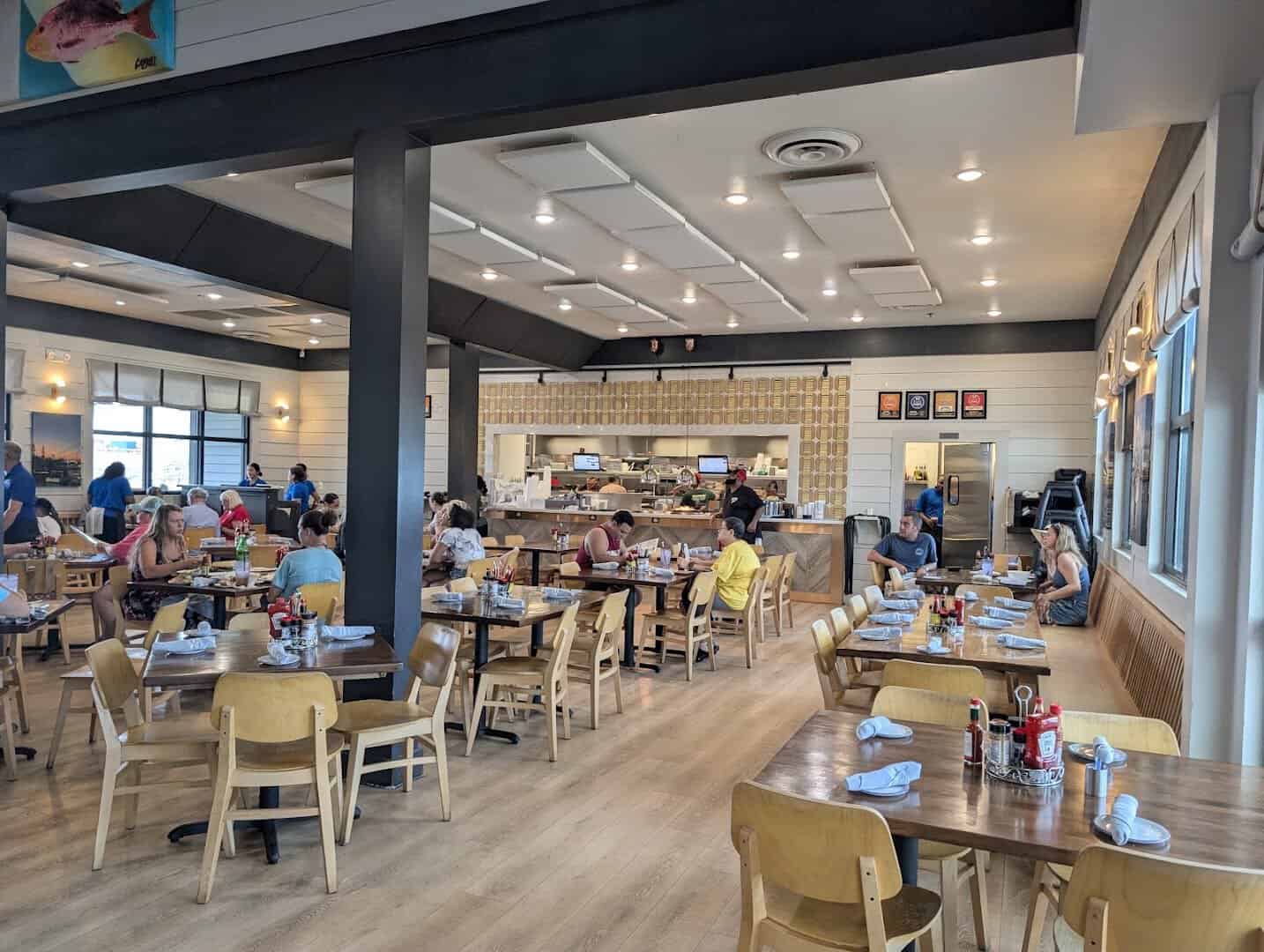 Bright dining room and open kitchen at Katie's Seafood House in Galveston