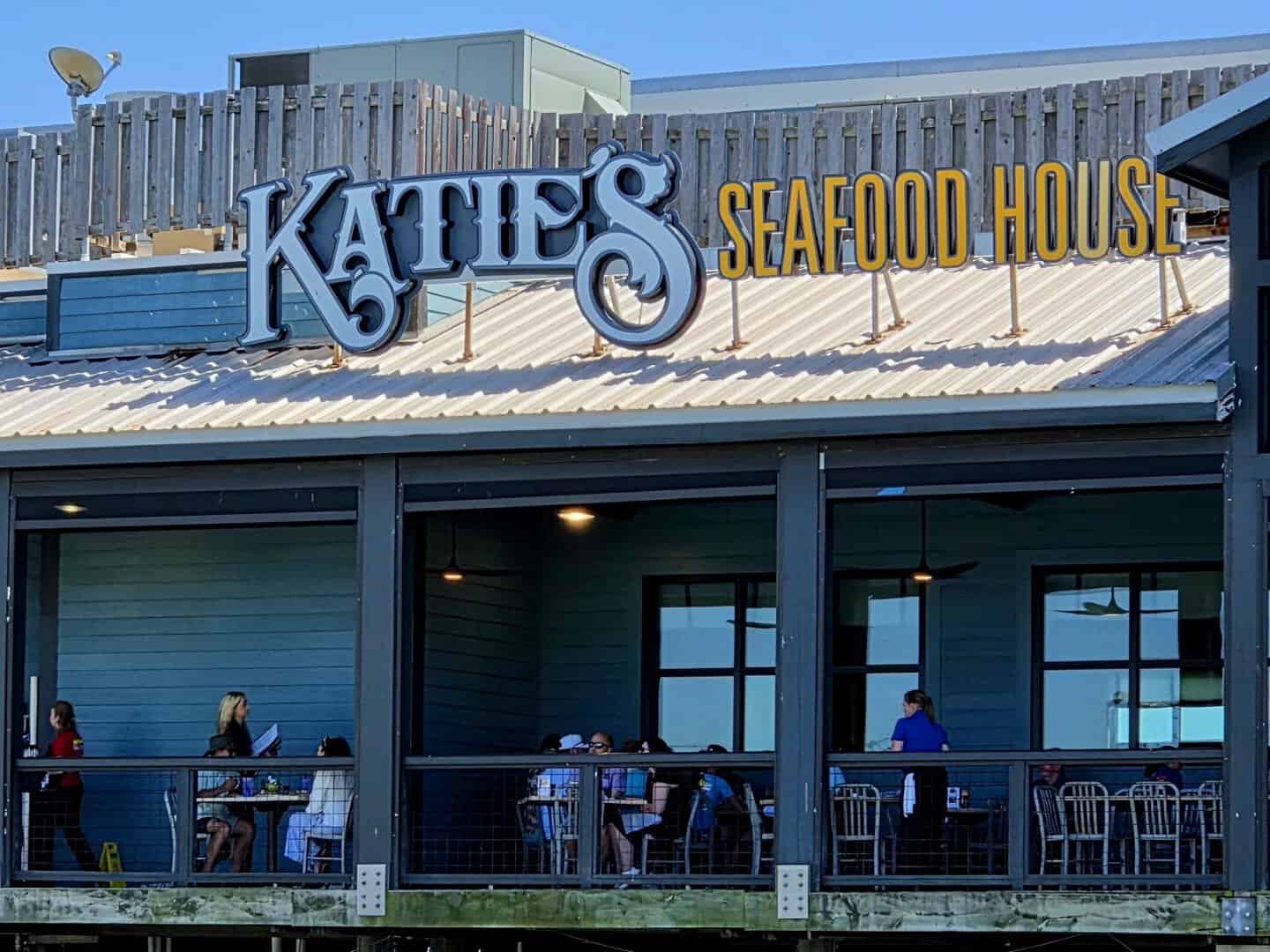 Katie's Seafood House sign above the waterfront patio in Galveston