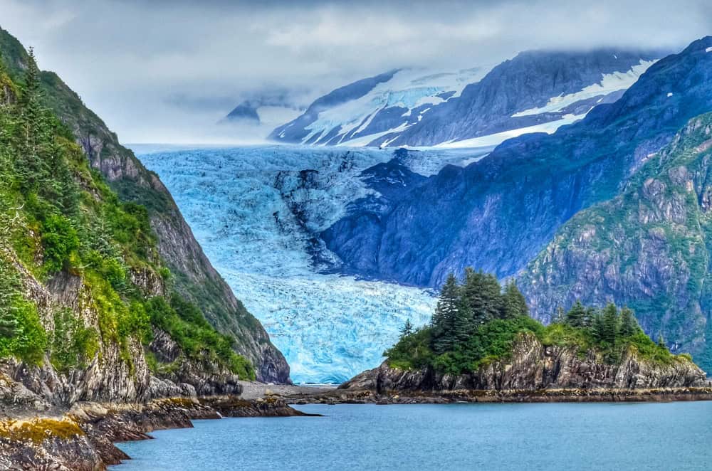 A tidewater glacier flowing into the sea at Kenai Fjords National Park, Alaska
