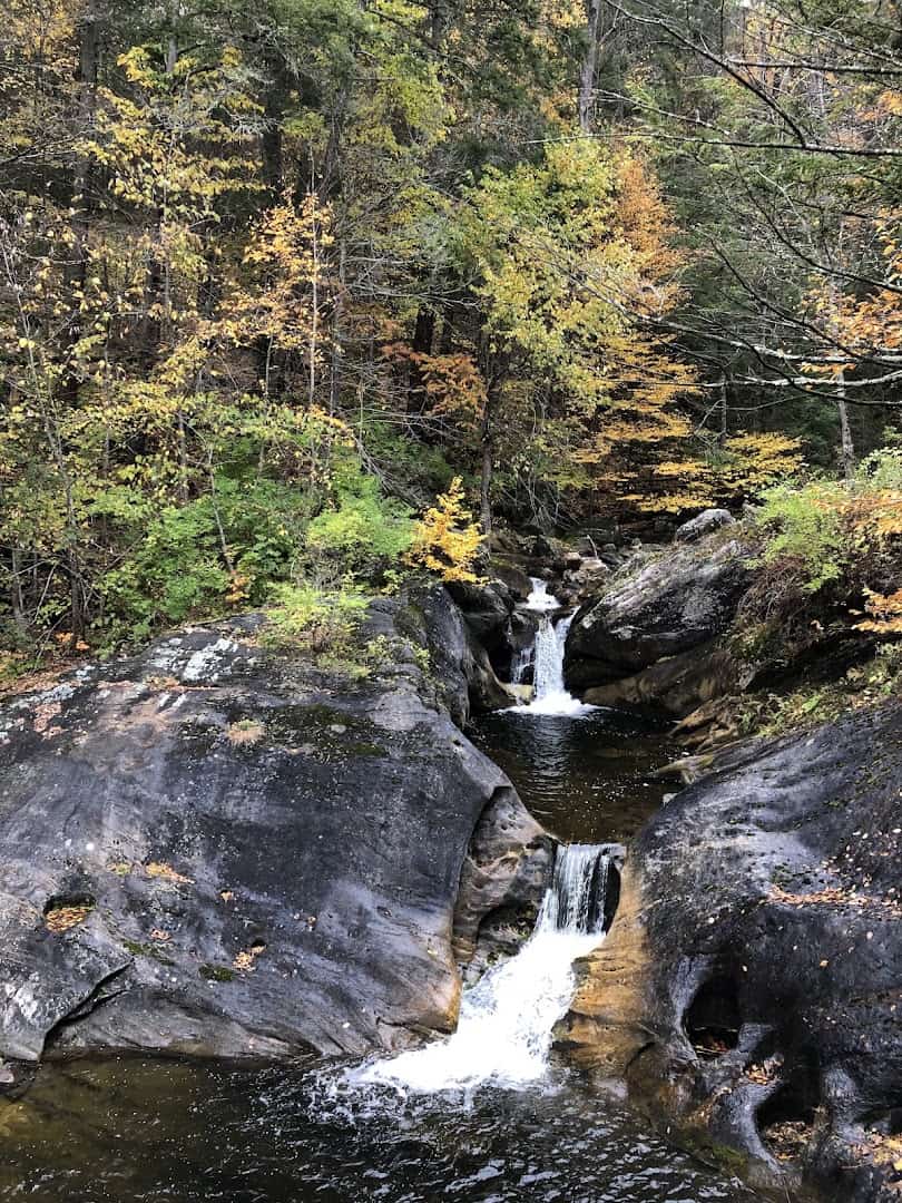 Kent Falls cascading past autumn foliage in Kent, Connecticut