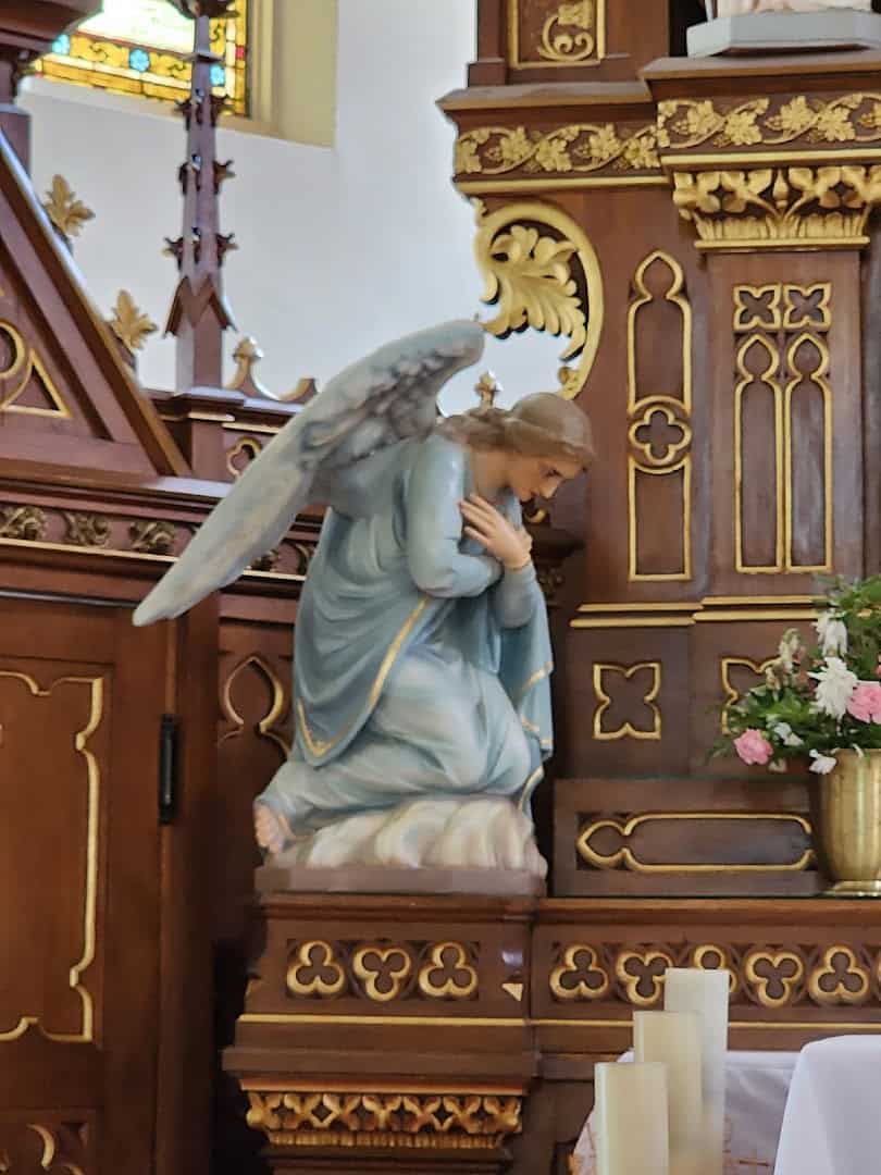 Kneeling angel statue inside St. Mary Catholic Church in High Hill, Texas