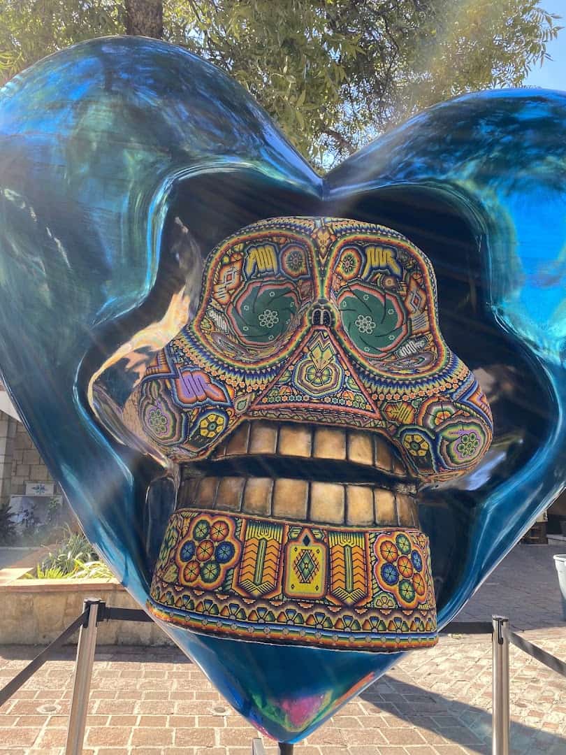 Colorful glass folk-art skull sculpture at La Villita arts village in San Antonio
