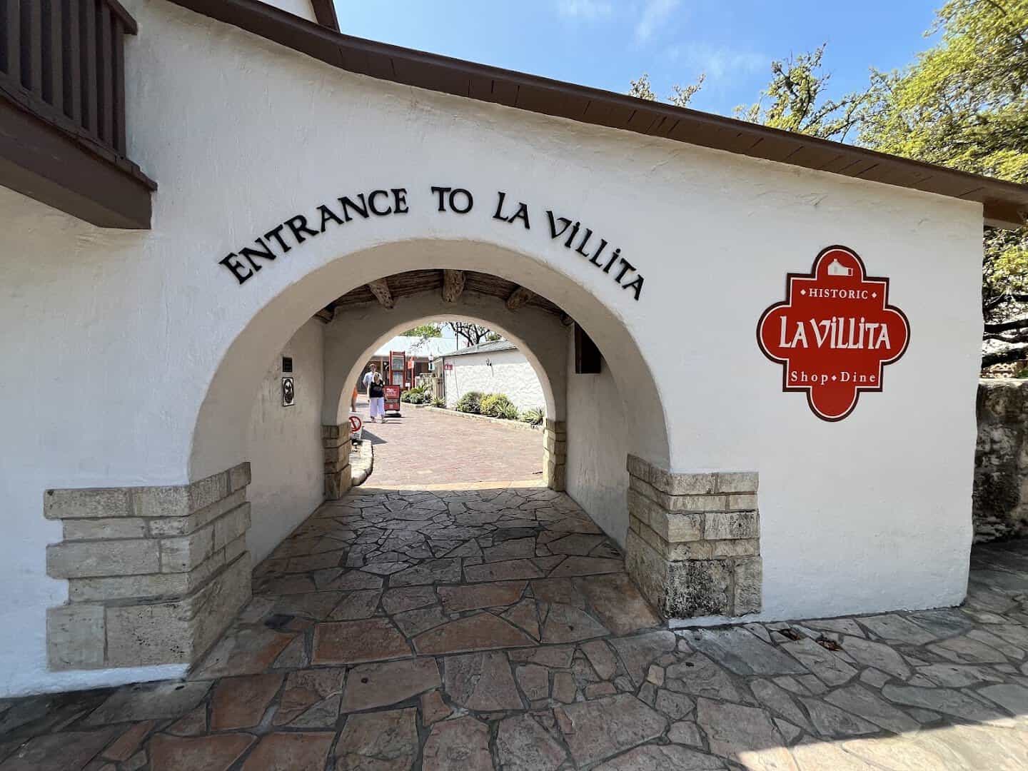 Stone entrance archway to La Villita historic village in San Antonio