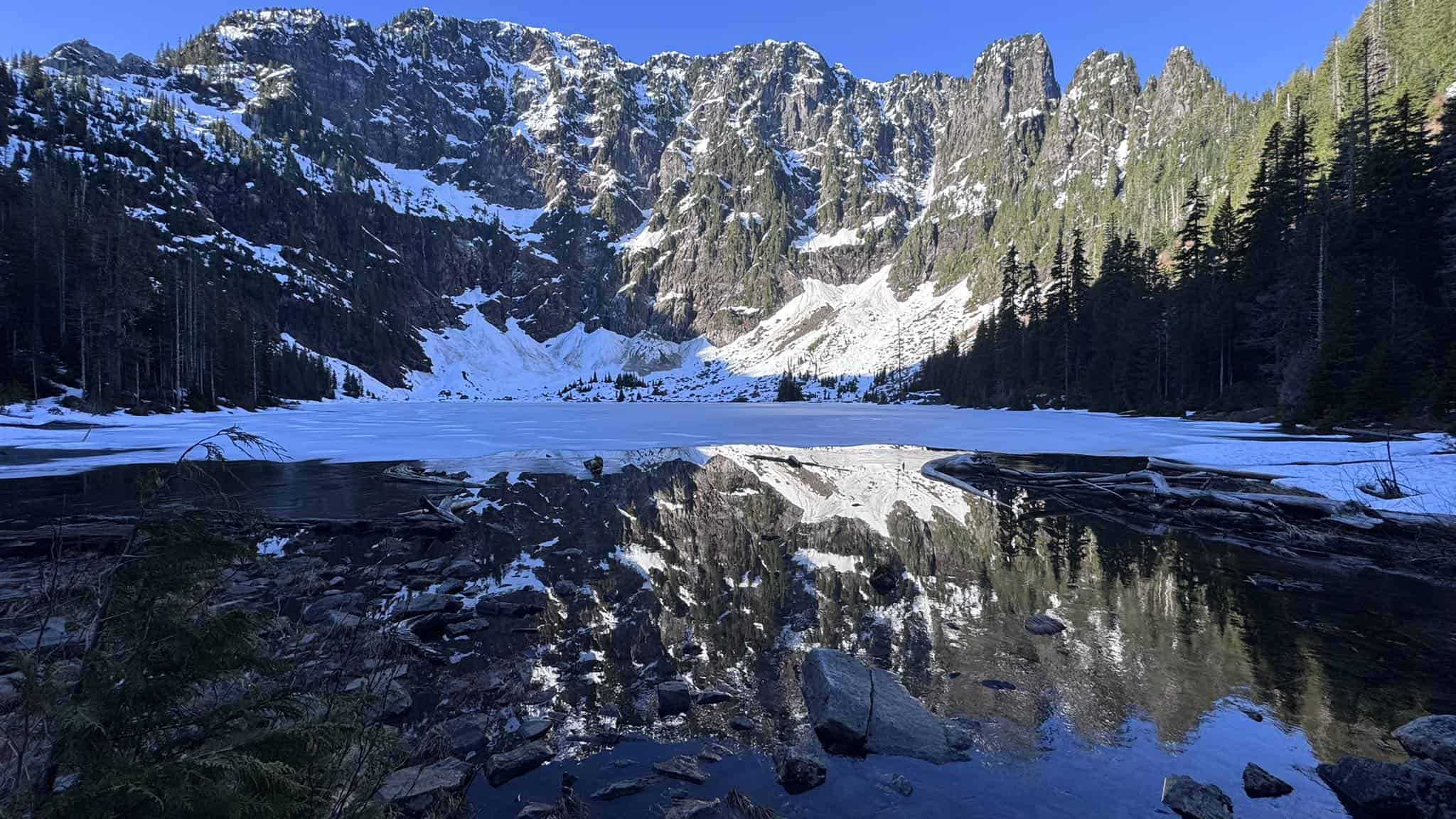 Snow-rimmed Lake 22 below Mount Pilchuck, Washington