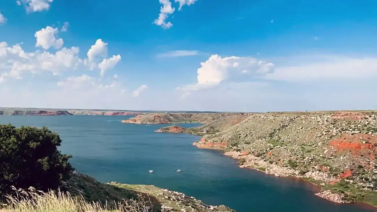 Blue water of Lake Meredith set inside red canyon walls in the Texas Panhandle