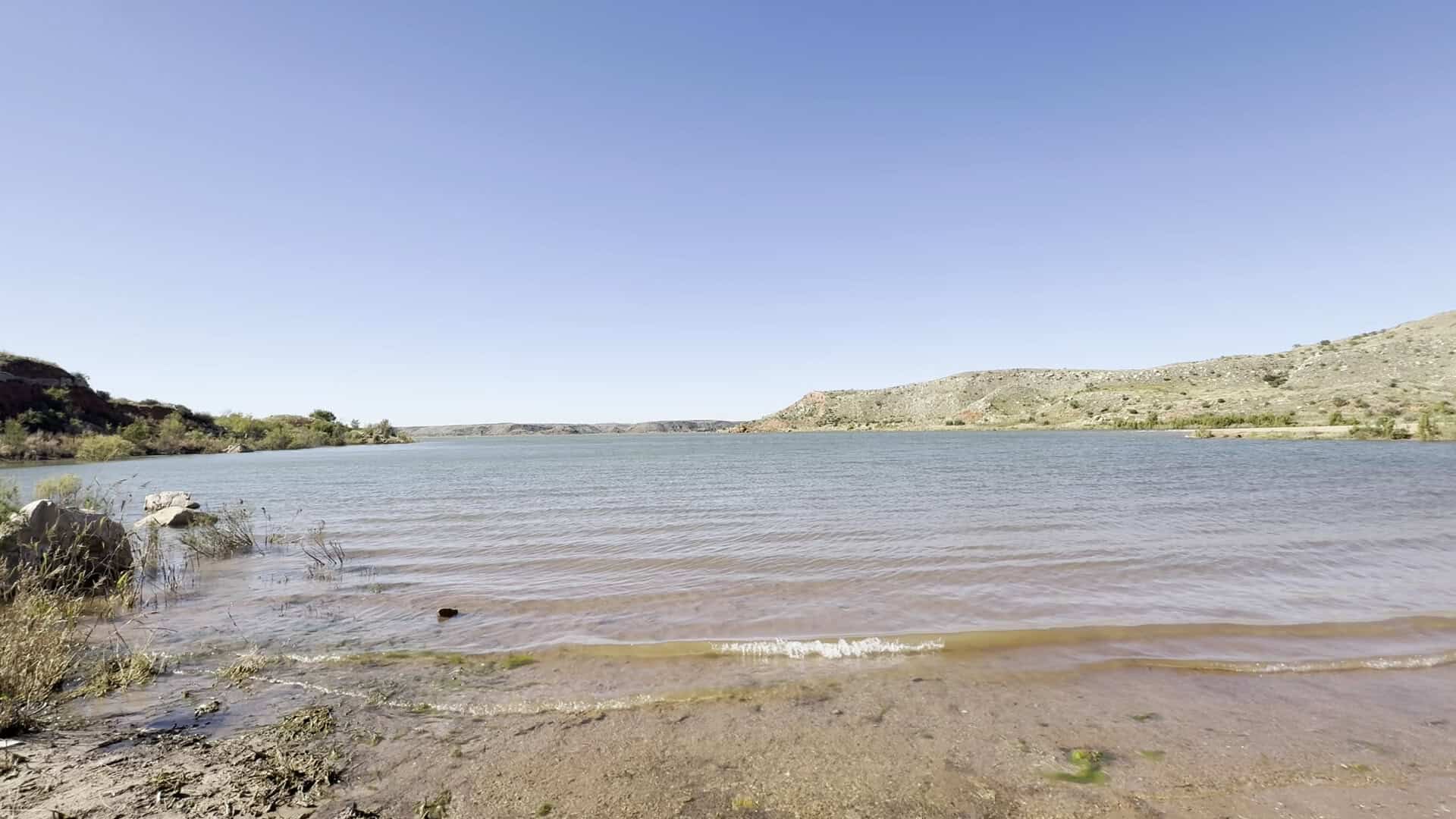 The broad reservoir of Lake Meredith filling the canyon