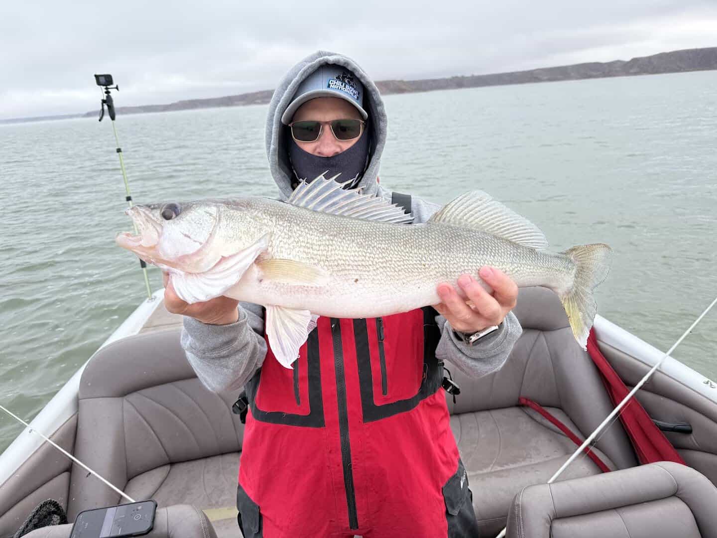 Angler holding a walleye caught at Lake Meredith