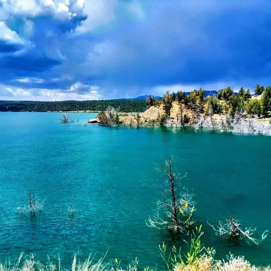 Turquoise water of Lake Nighthorse reservoir ringed by mountains near Durango, Colorado
