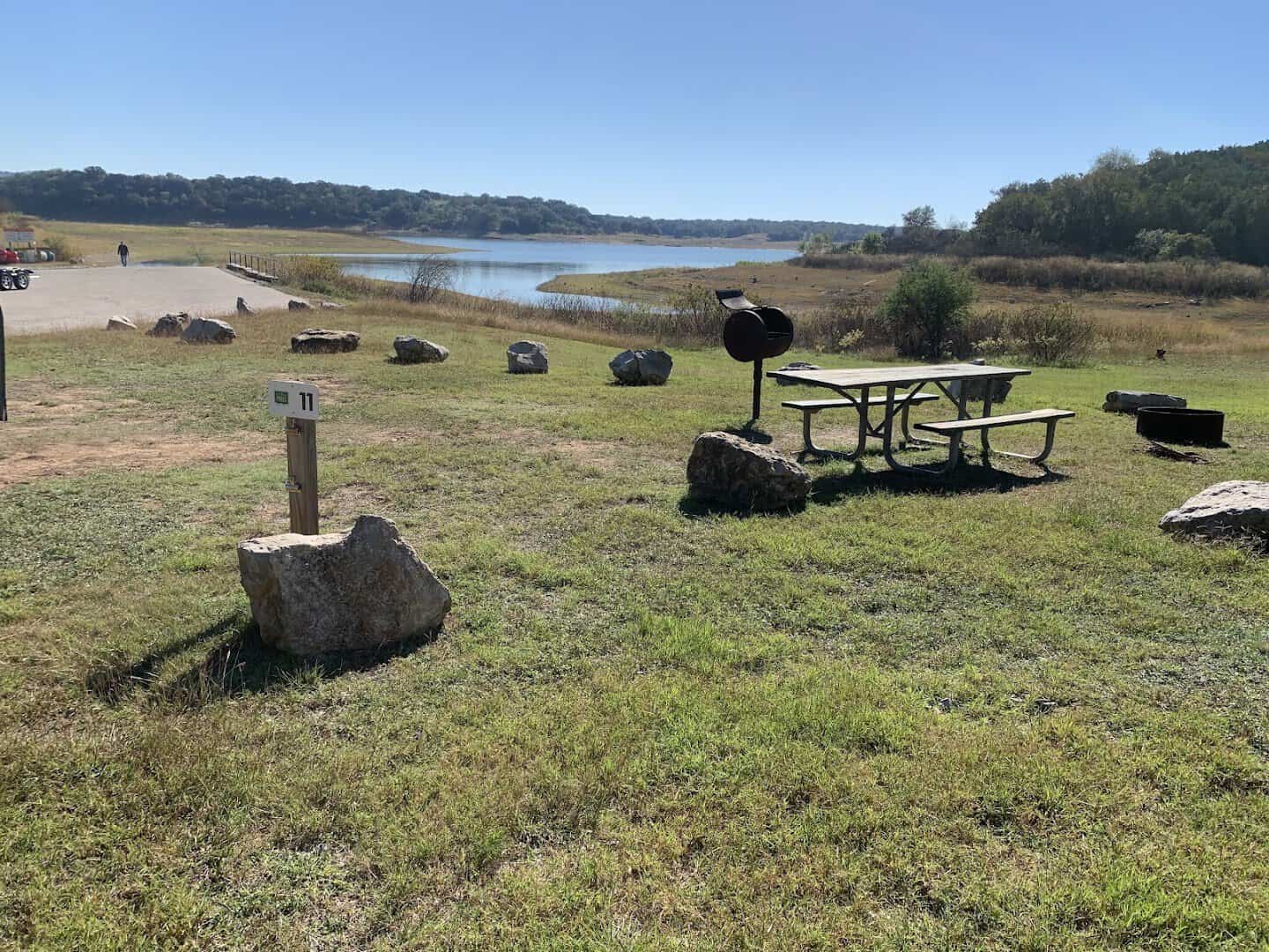 Lakeside campsite with picnic table and grill at Muleshoe Bend Recreation Area