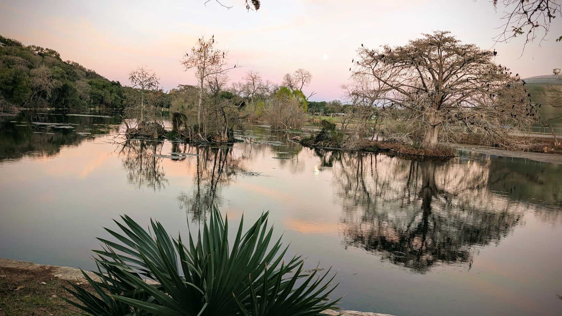 Sunset reflecting on Landa Lake in New Braunfels