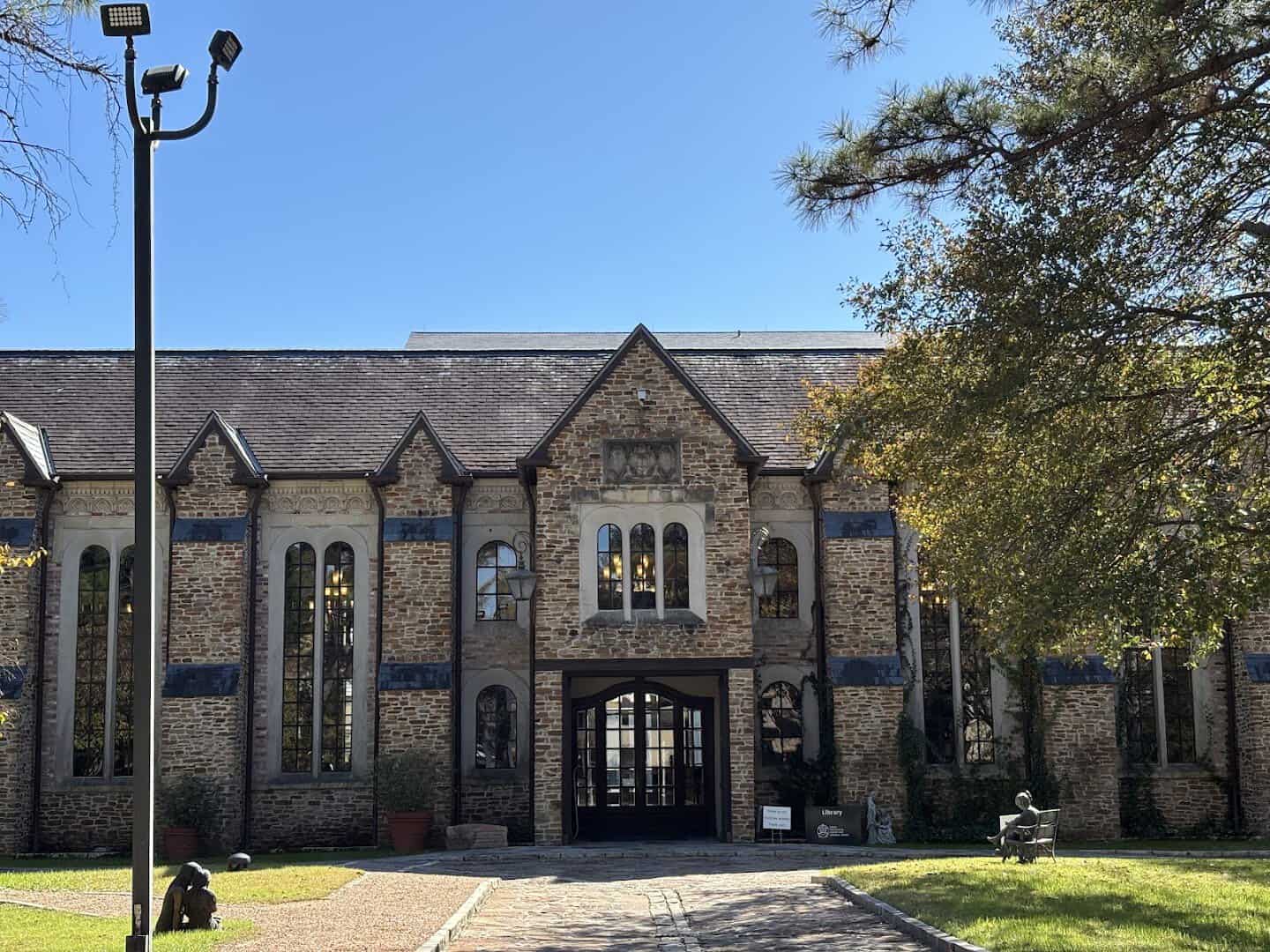 The gated stone entrance and grounds of the Lanier Theological Library in northwest Houston, Texas