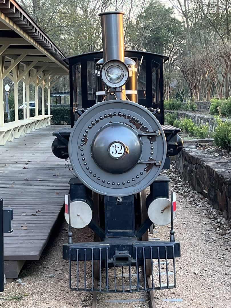 A steam locomotive on the English-style grounds of the Lanier Theological Library in Houston