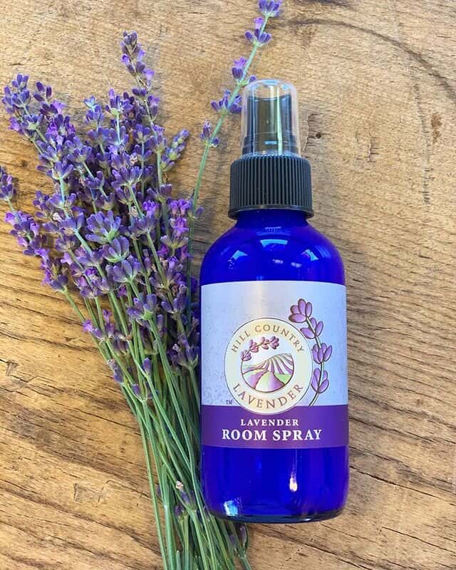 Hill Country Lavender room spray beside a bundle of fresh lavender