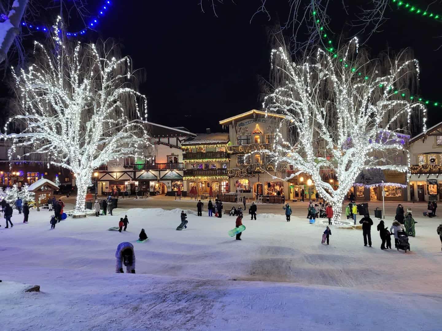 Snow-covered Front Street glowing with holiday lights in Leavenworth, Washington