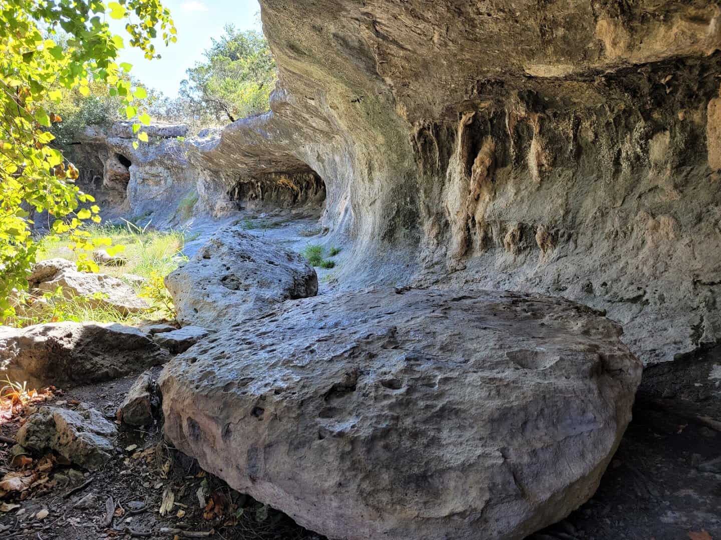 Limestone ledge and overhang beside the swimming pool at Tonkawa Falls City Park in Crawford, Texas