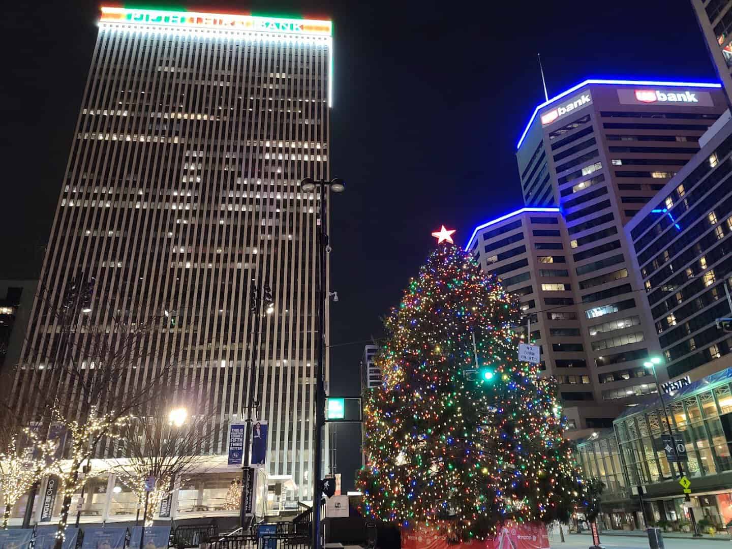 A lit Christmas tree with a red star at Fountain Square, Cincinnati, Ohio