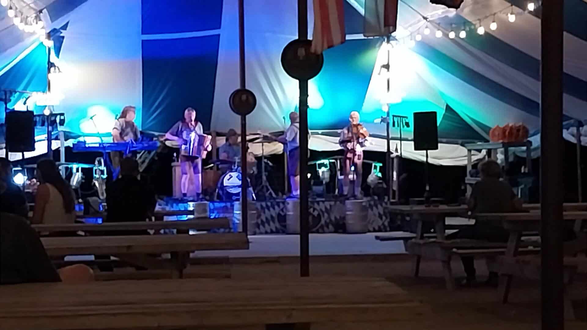 Live band playing on the biergarten stage at Walburg German Restaurant