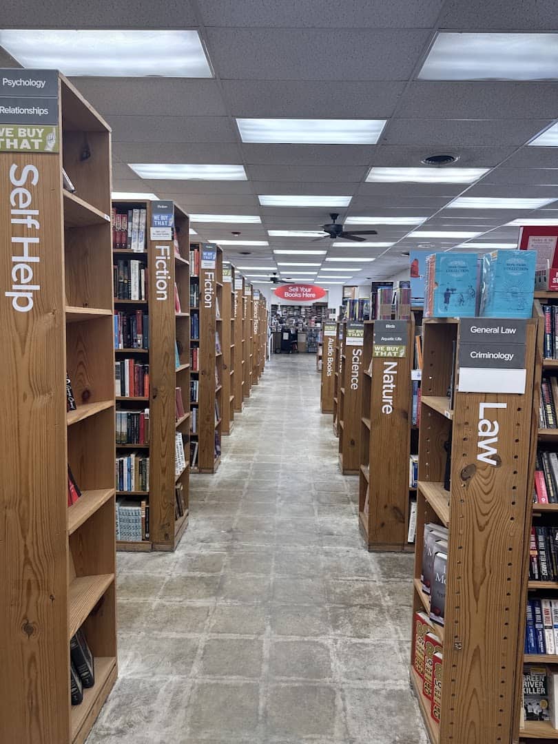 A long aisle of bookshelves at the Half Price Books flagship in Dallas