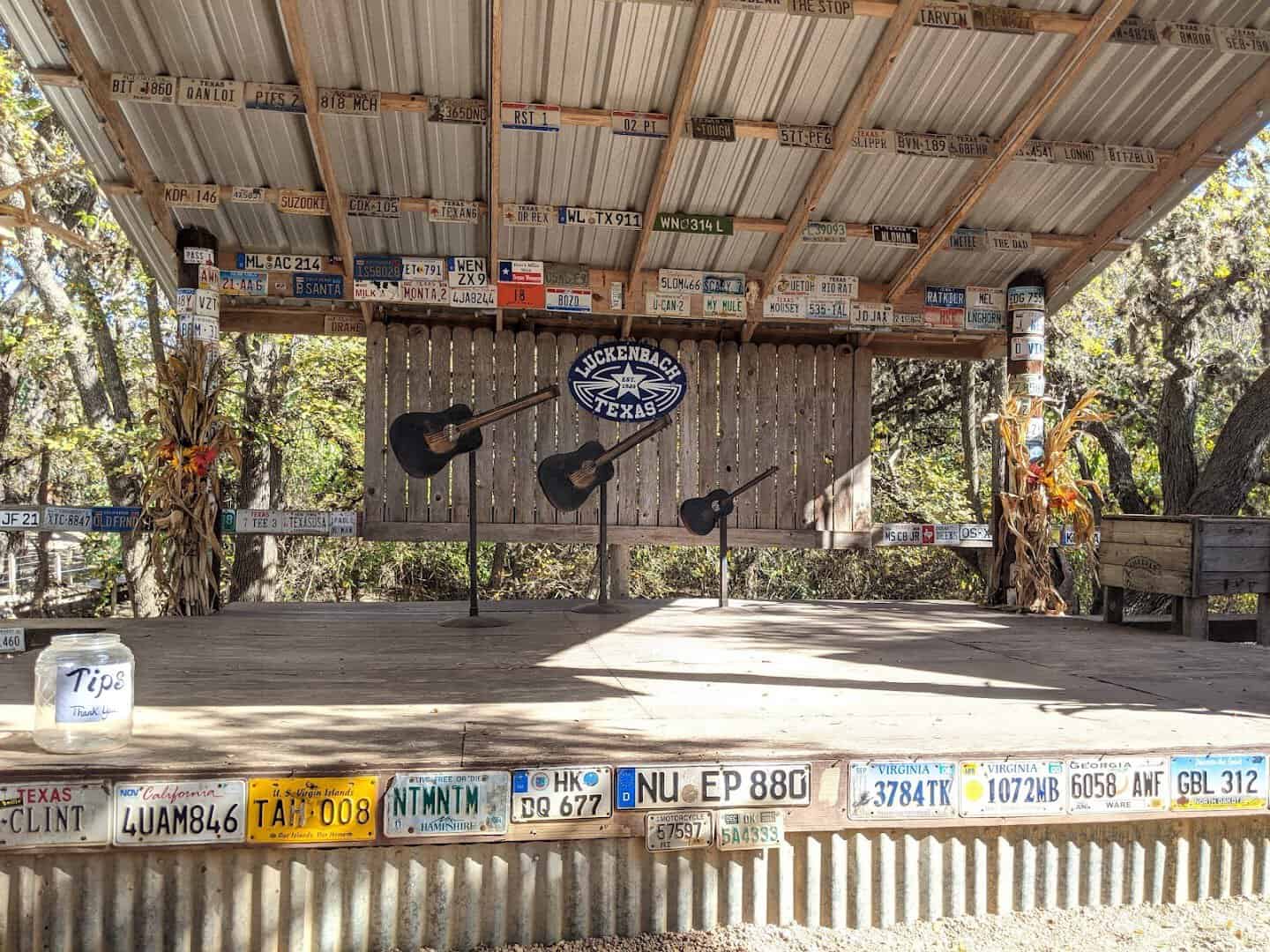 The Luckenbach outdoor stage with guitars and license plates