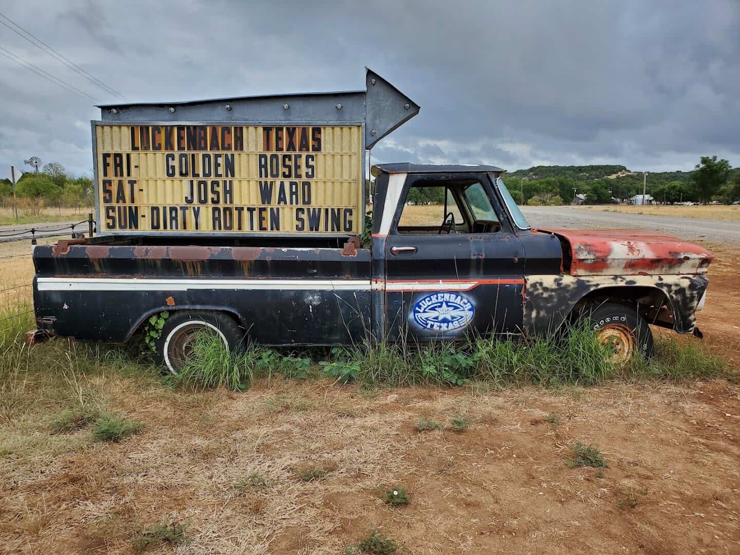 Vintage pickup truck with a hand lettered show sign at Luckenbach Texas