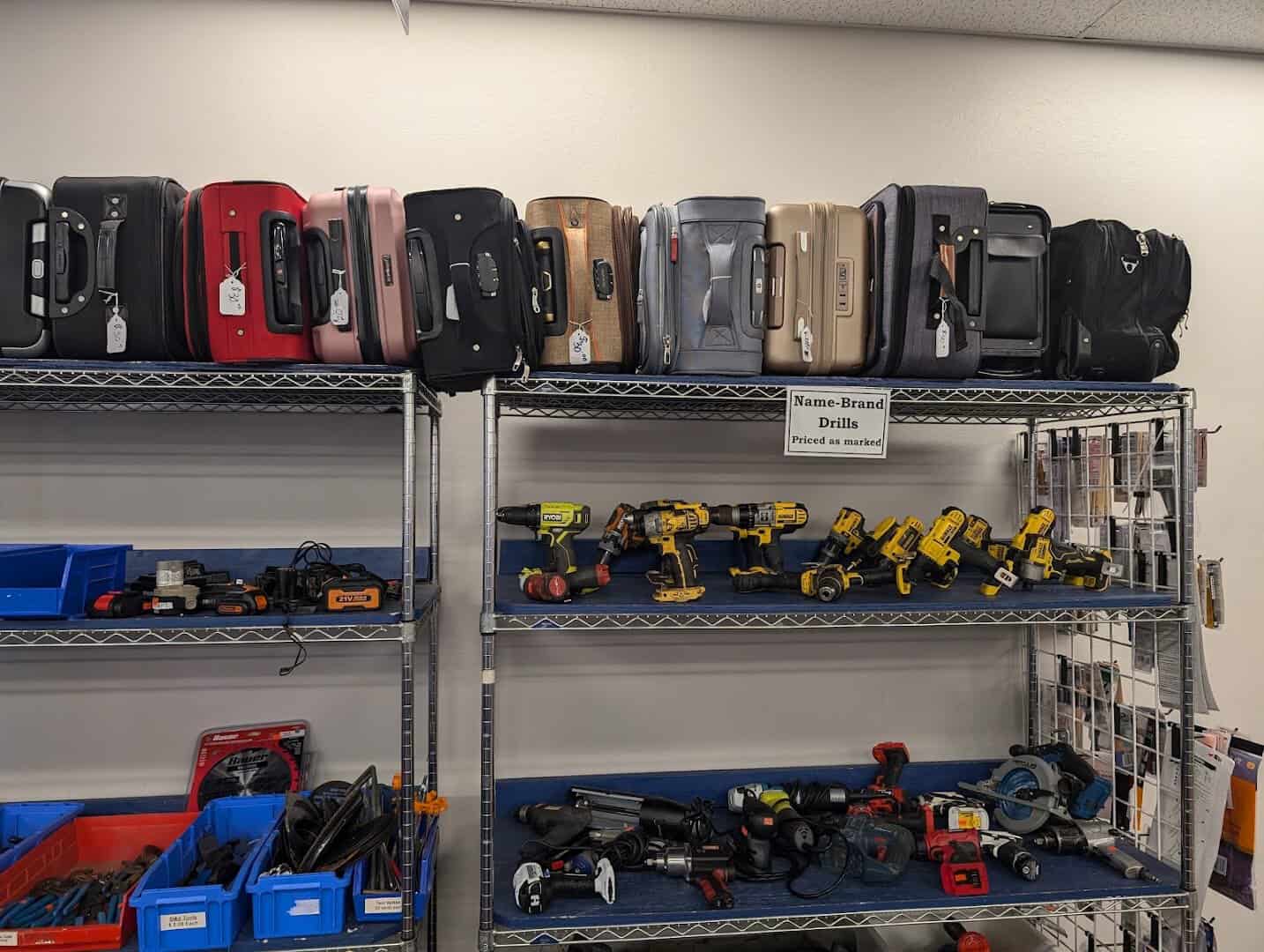 Shelves of abandoned luggage and power tools at the State Surplus Store in Austin