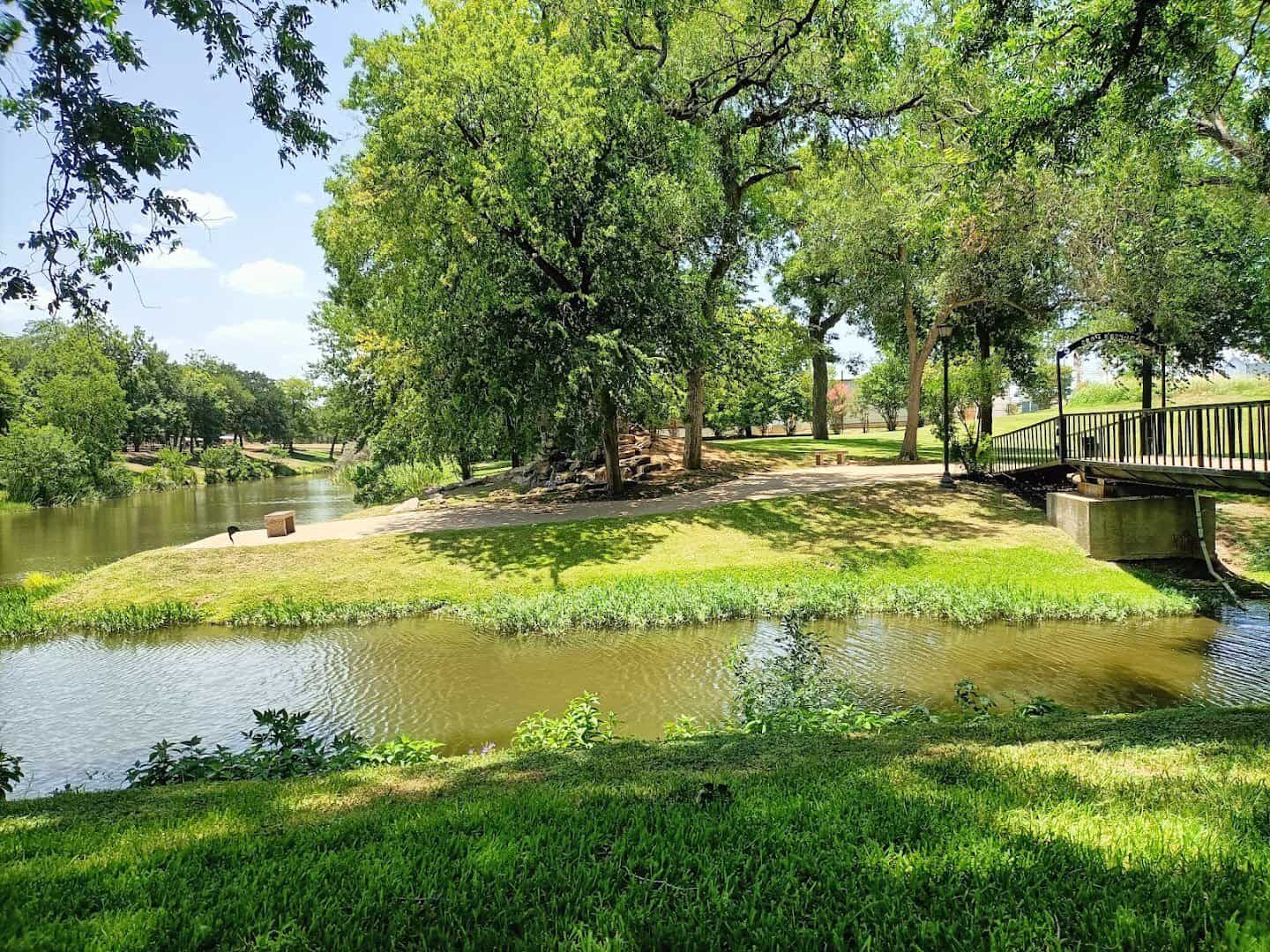 Pond and footbridge at a park in Marble Falls, Texas