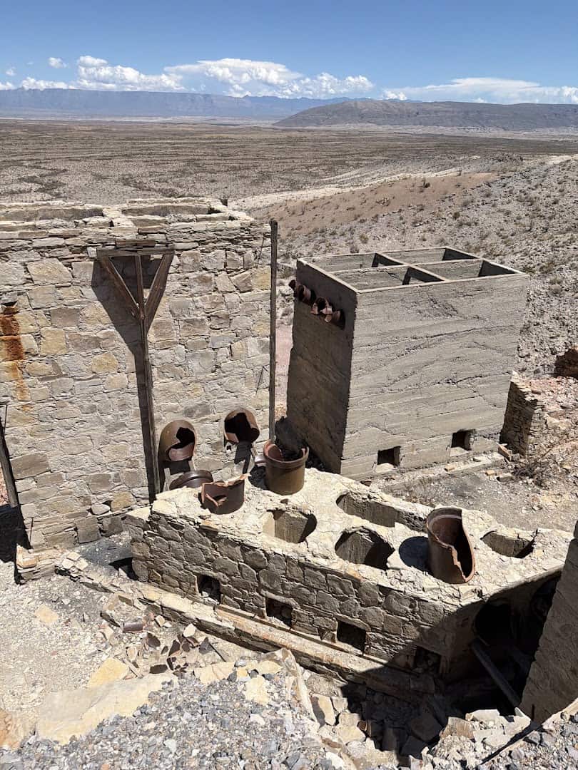 Iron condensers and stone processing walls at Mariscal Mine seen from above the trail