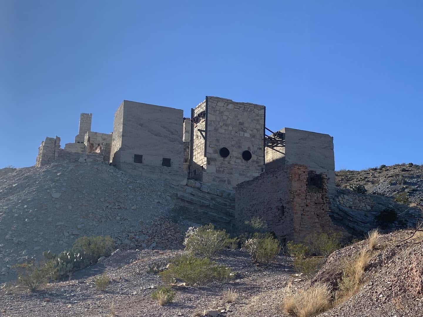 Stone ruins of Mariscal Mine rising above the desert on Mariscal Mine Trail in Big Bend National Park