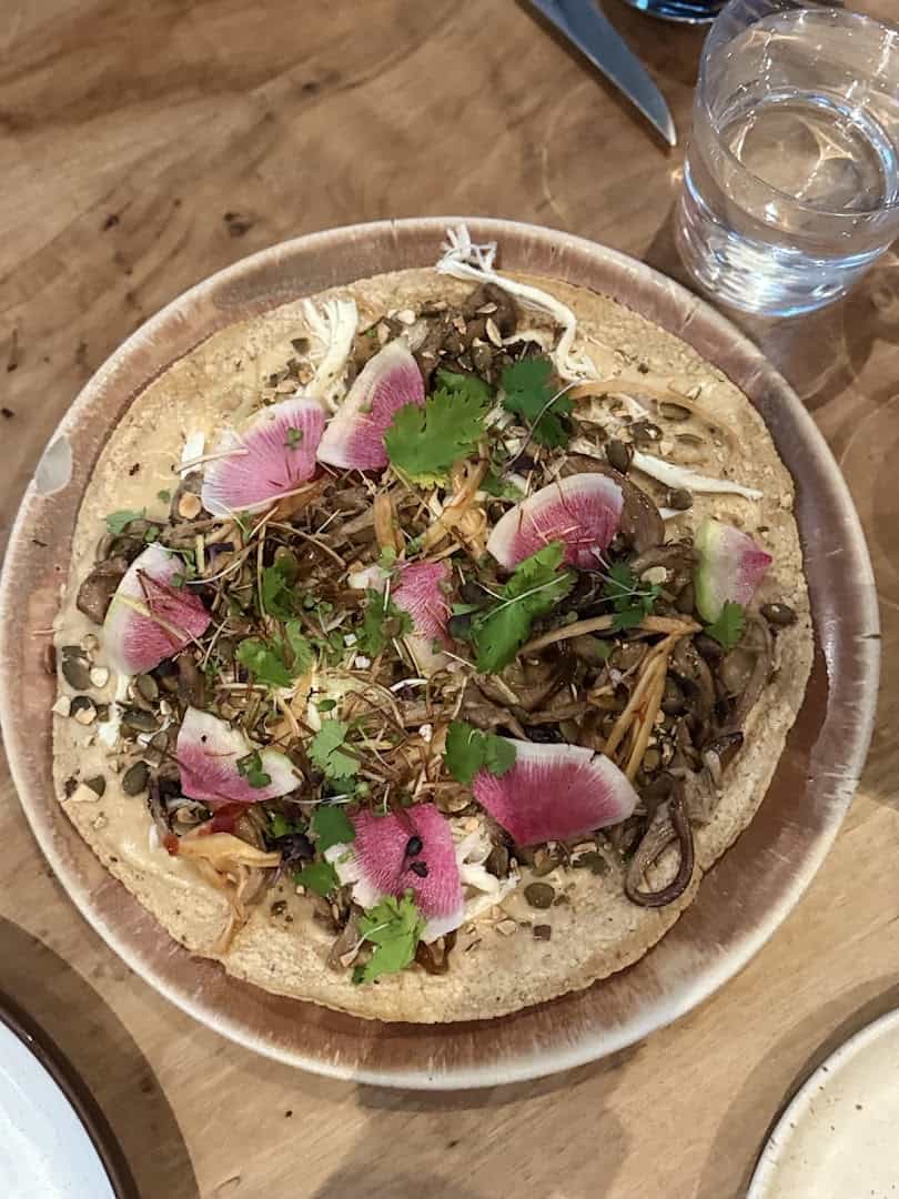 Masa dish with braised meat and radish at Suerte in Austin