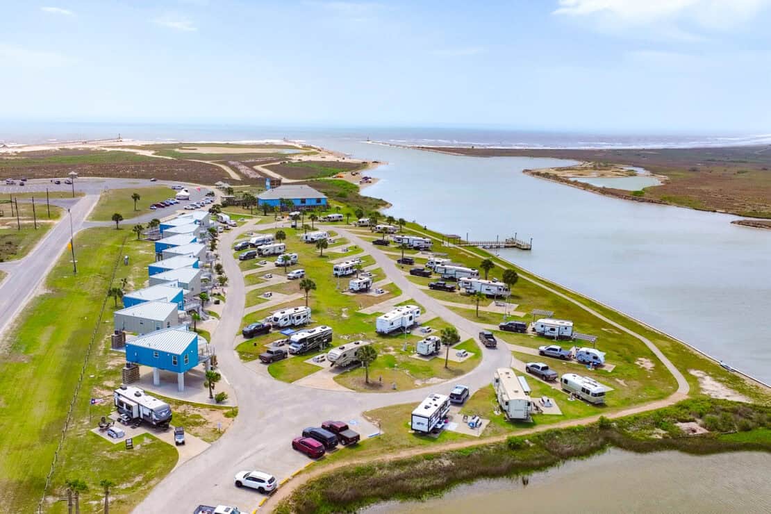 Aerial view of the Colorado River meeting the Gulf at Matagorda Bay Nature Park, Texas