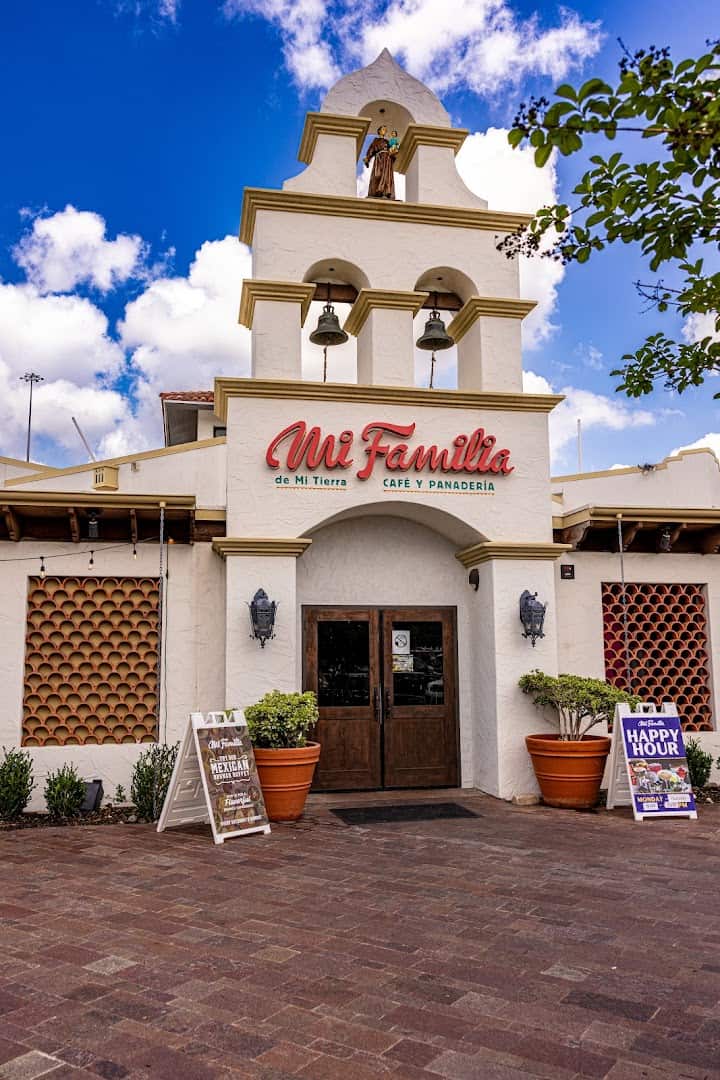 Mission-style exterior and bell tower of Mi Familia at the Rim in San Antonio