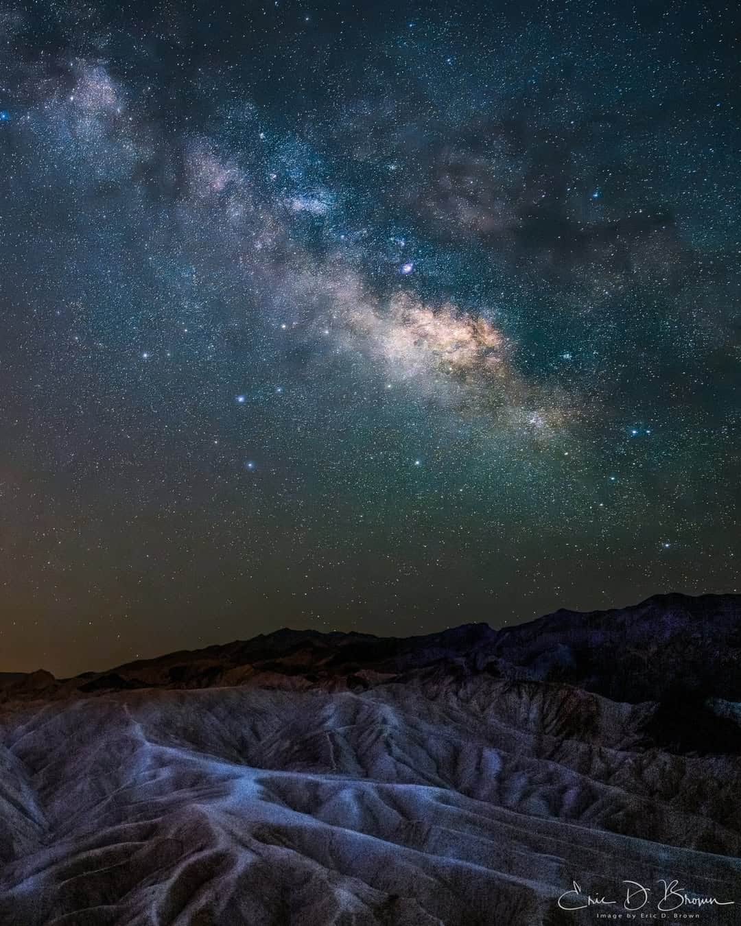 The Milky Way rising over the Zabriskie badlands at Death Valley National Park, California