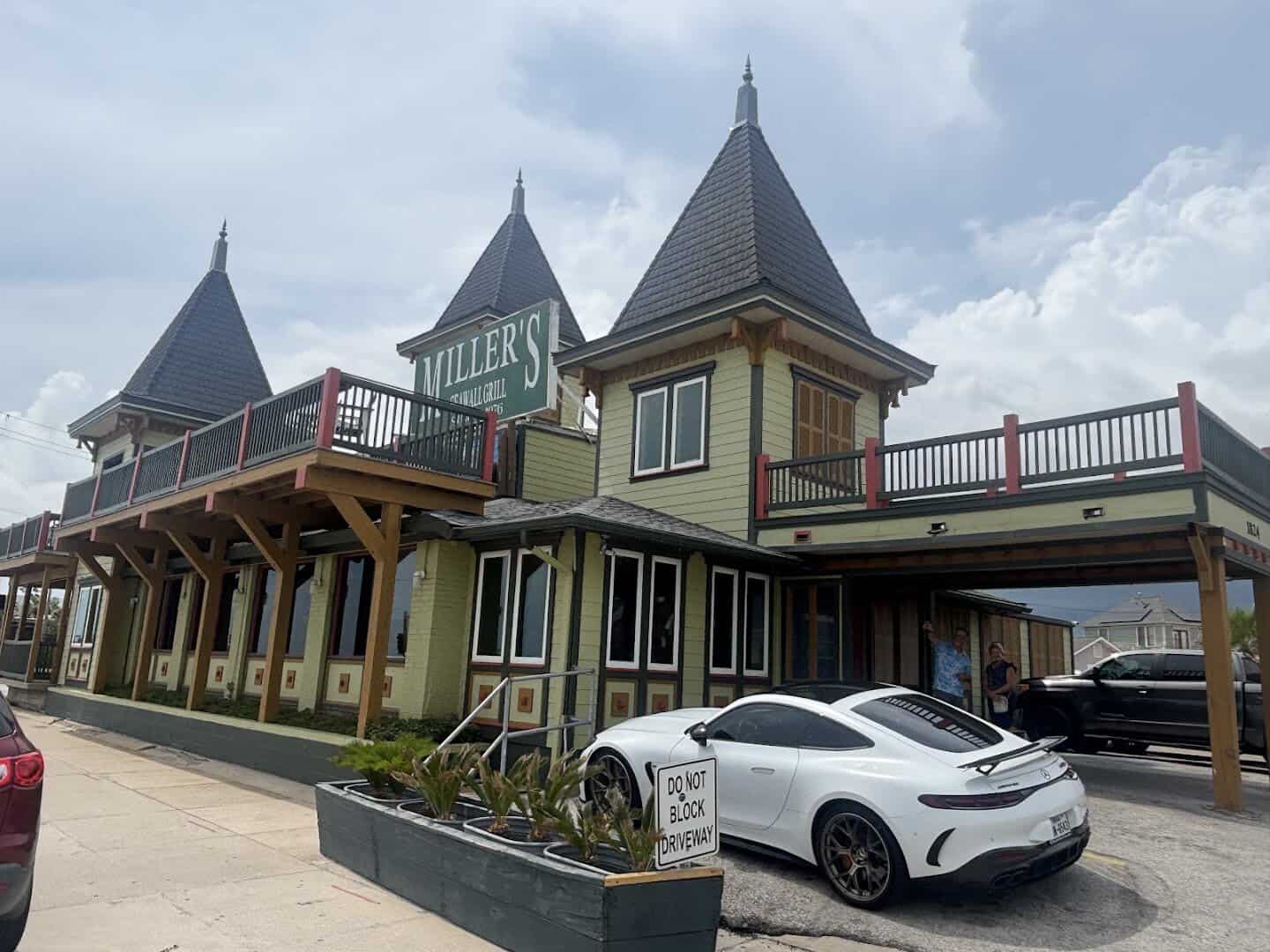 The yellow Victorian building of Miller's Seawall Grill on the Galveston seawall