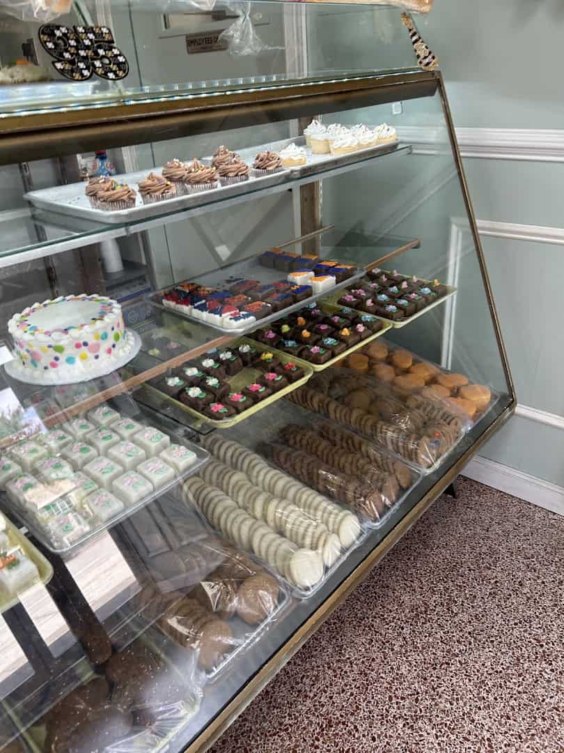 A display case of cookies and petit fours at Moeller's Bakery in Houston