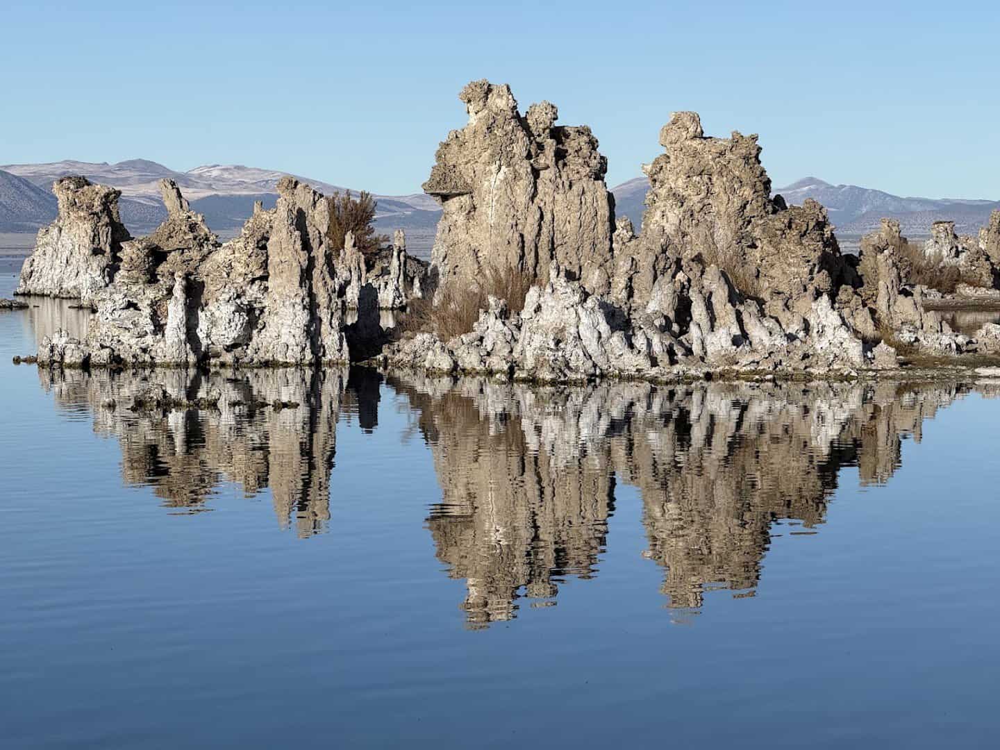 Tufa spires reflected in the still water of Mono Lake South Tufa, California