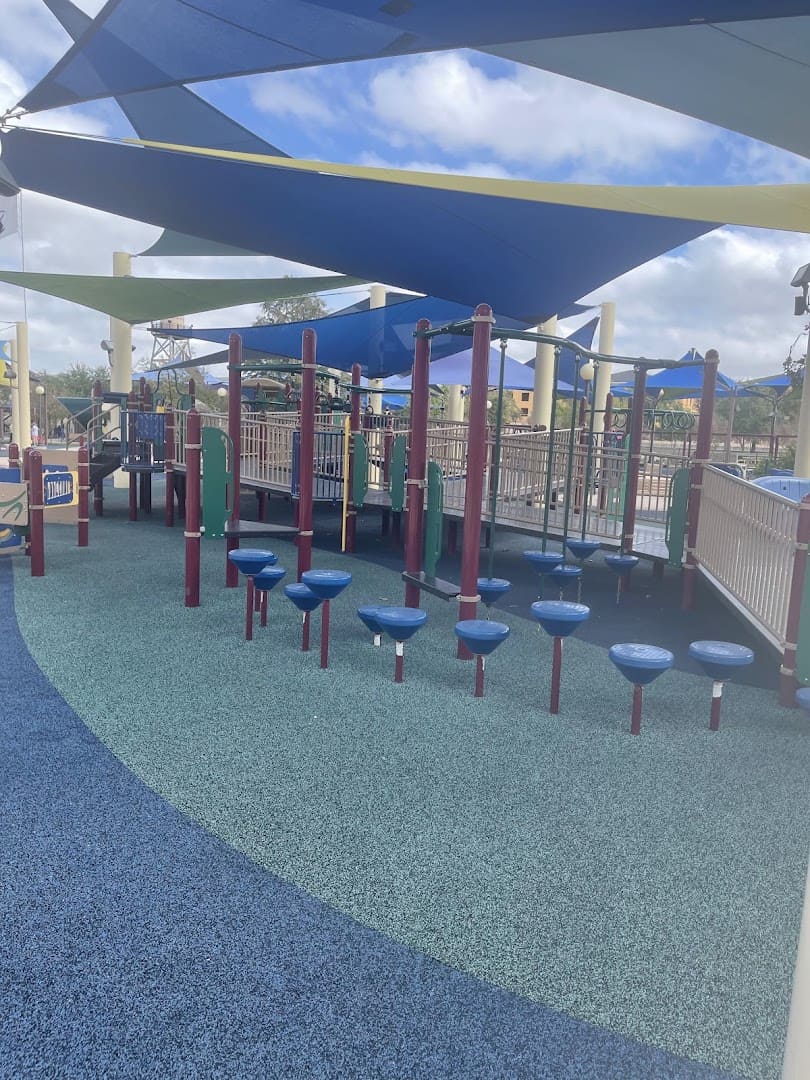 Wheelchair-accessible splash pads under shade sails at Morgan's Inspiration Island in San Antonio