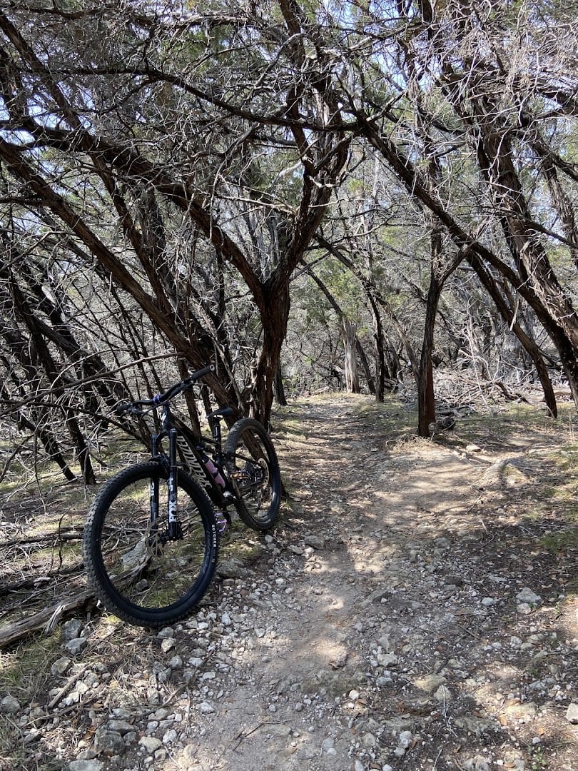 Mountain bike resting on a shaded single track trail at Muleshoe Bend