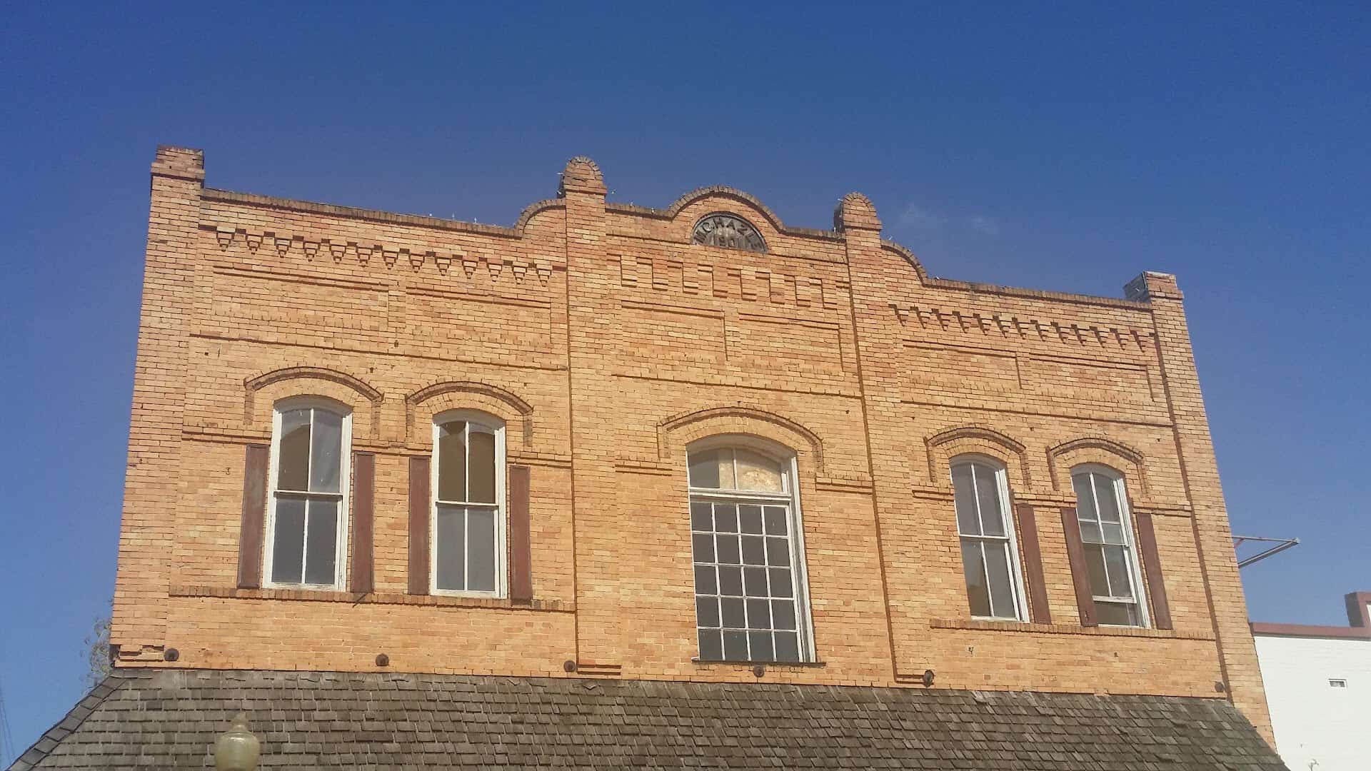 Historic light brick commercial building facade in downtown Nacogdoches