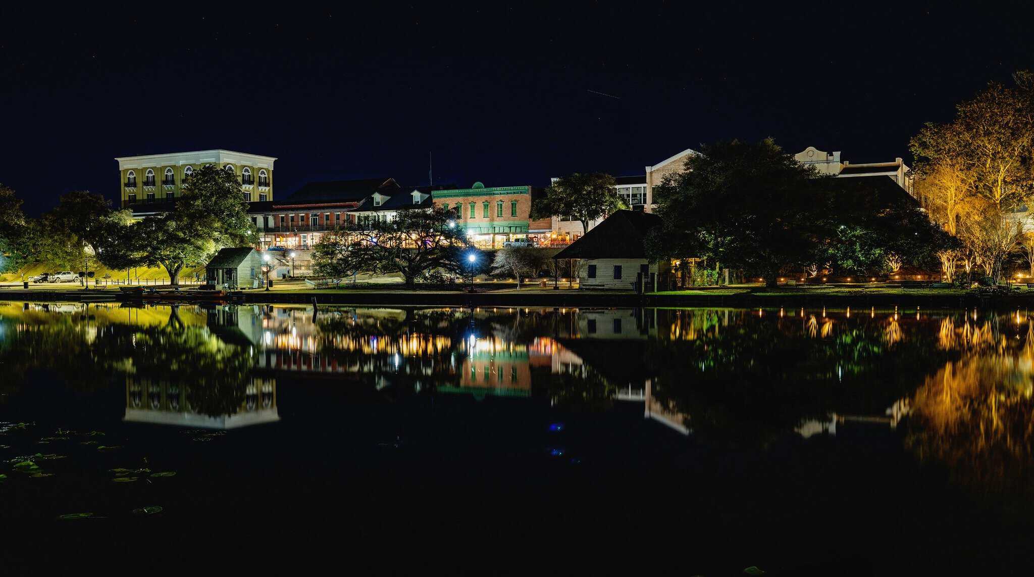 The Cane River riverbank glowing with lights at night, Natchitoches, Louisiana