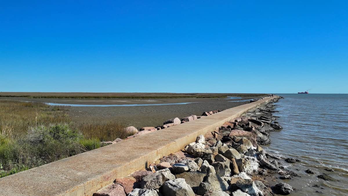 The North Jetty fishing walkway stretching into the water on Bolivar Peninsula