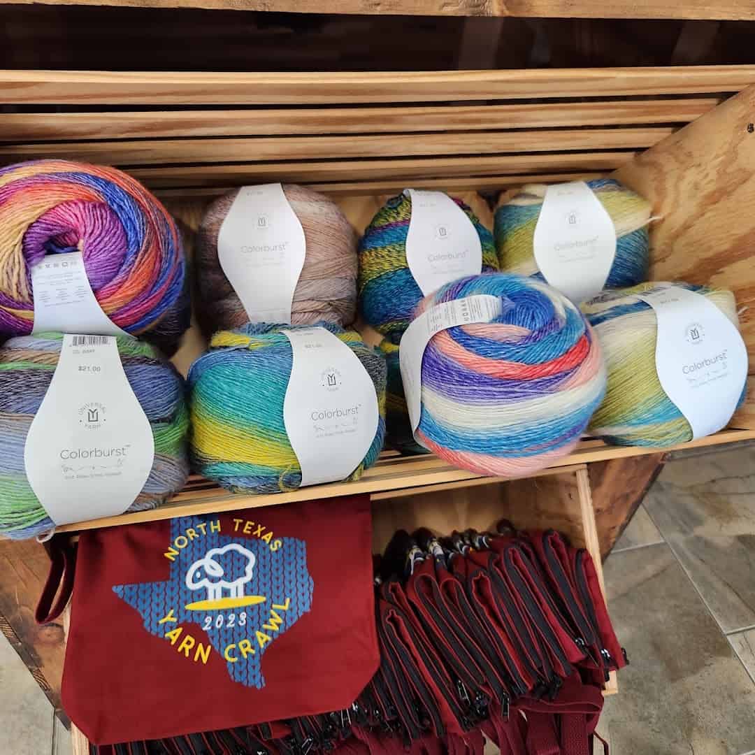 Colorful variegated yarn and a North Texas Yarn Crawl tote at Lone Star Yarn in Bedford, Texas