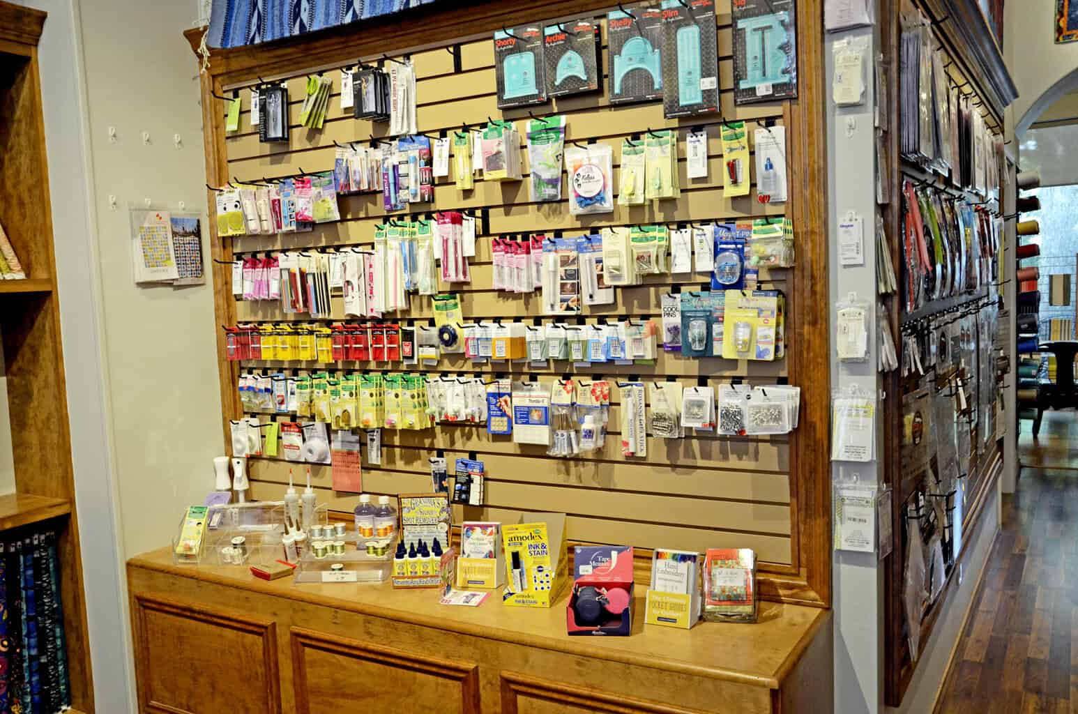 Notions wall and checkout counter at The Quilted Skein in La Grange, Texas