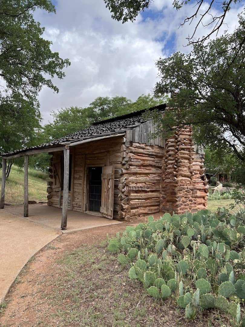 Historic log cabin at the National Ranching Heritage Center in Lubbock, Texas