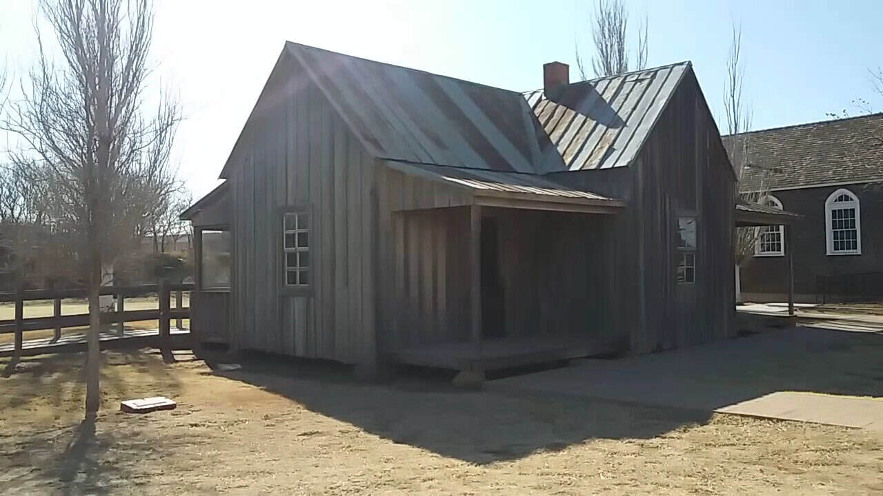 Weathered historic wooden ranch building at the National Ranching Heritage Center in Lubbock, Texas